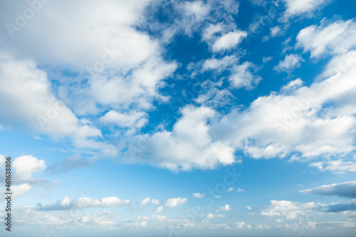 Obraz na płótnie Stunning view of a blue sky with some fluffy clouds during a sunny day. Natural background, sky replacement, copy space.. w salonie