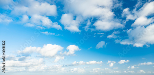 Obraz na płótnie Stunning view of a blue sky with some fluffy clouds during a sunny day. Natural background, sky replacement, copy space.. w salonie