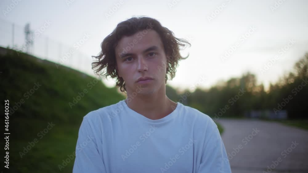 Punk man portrait wearing a protective medical mask, covid safety, coronavirus pandemic, millennial boy on street, generation z students university life