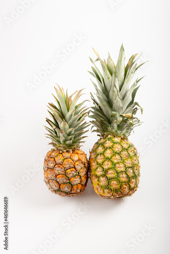 Two beautiful pineapples on white background