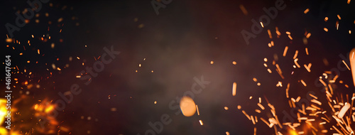 Halloween Witch . Fire embers particles over black background. Fire sparks background. Abstract dark glitter fire particles lights.