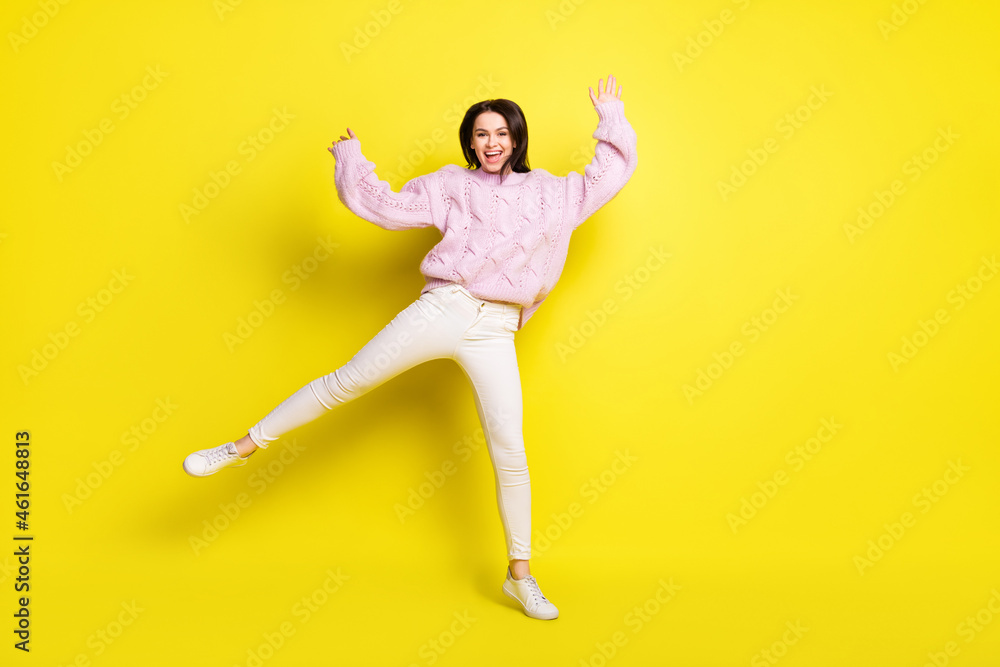 Fototapeta premium Full size photo of funny millennial lady dance wear sweater pants isolated on yellow color background