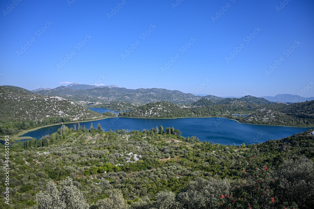 View on blue lake between green hills in nature. Bacinska jezera, Ploce, Craotia. Panoramic view of Baćina lakes.
