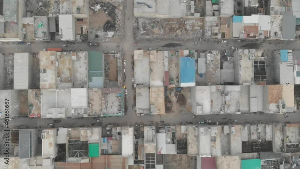Aerial Top Down View Of Patchwork Rooftops In Downtown Karachi. Pedestal Up Aerial Top Down View Of Patchwork Rooftops In Downtown Karachi. Pedestal Up