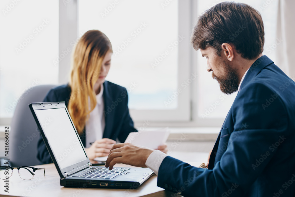 managers sitting in front of a laptop teamwork internet technologies managers sitting in front of a laptop teamwork internet technologies