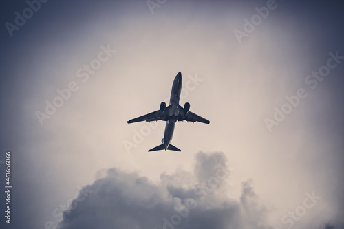 plane and gray sky, plane takes off into the sky