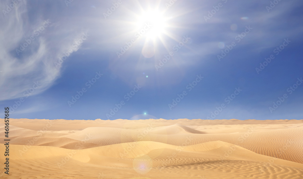 Naklejka premium Picturesque view of sandy desert and blue sky on hot sunny day