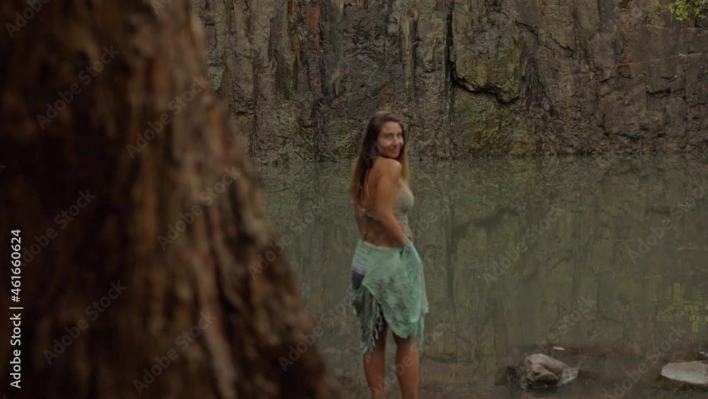 Lovely Tourist Standing On The Pool Behind Woods - Cedar Creek Falls In QLD Australia. Dolly Shot Lovely Tourist Standing On The Pool Behind Woods - Cedar Creek Falls In QLD Australia. Dolly Shot