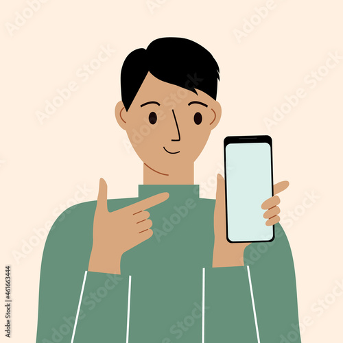 Joyful man with mobile phone, front view. Points her finger at the phone screen. Smartphone and internet addiction.