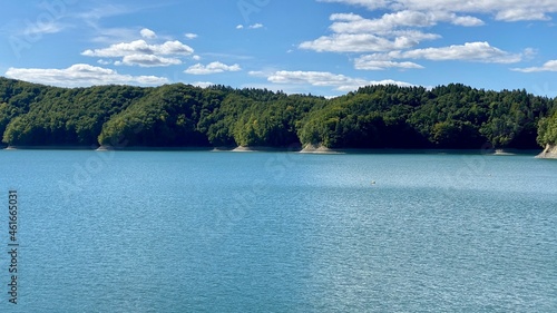Lake Solinskie with rocky shores covered with dense coniferous forest