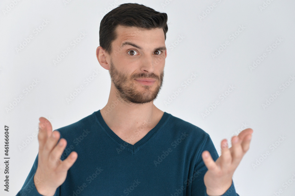 Handsome young man showing something in studio Handsome young man showing something in studio