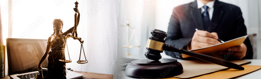 Male lawyer working with contract papers and wooden gavel on tabel in courtroom. justice and law ,attorney, court judge, concept. Male lawyer working with contract papers and wooden gavel on tabel in courtroom. justice and law ,attorney, court judge, concept.