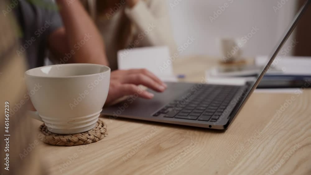 caucasian couple working from home on laptop sorting out finances