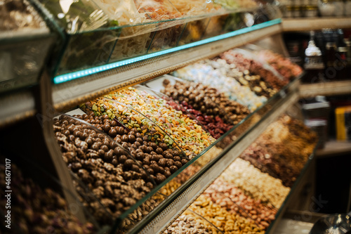 rows of candy assortments lined up in the window of a sweet shop