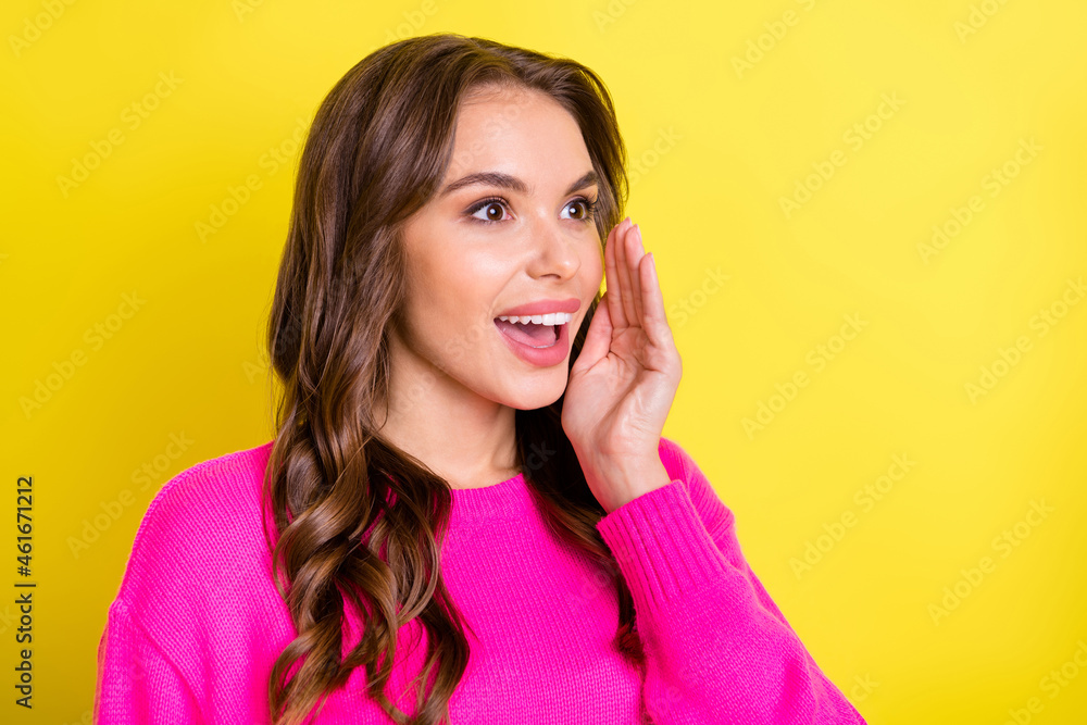 Fototapeta premium Photo of charming funky woman wear pink sweater arm mouth making announcement isolated yellow color background