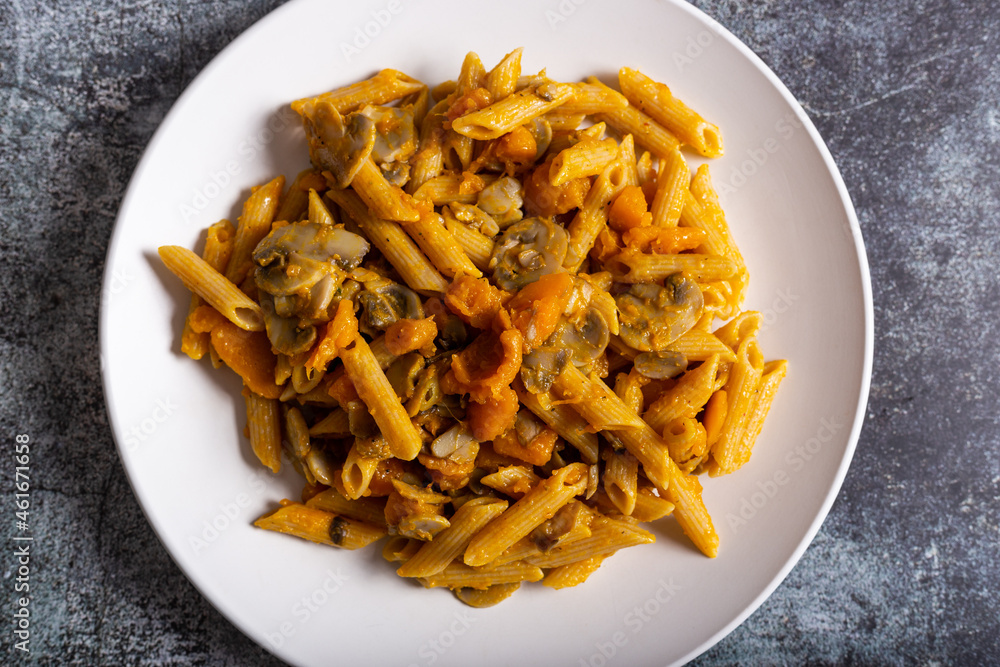 Pasta with pumpkin and mushrooms, a complete vegetarian dish. Ideal for an autumn lunch Pasta with pumpkin and mushrooms, a complete vegetarian dish. Ideal for an autumn lunch