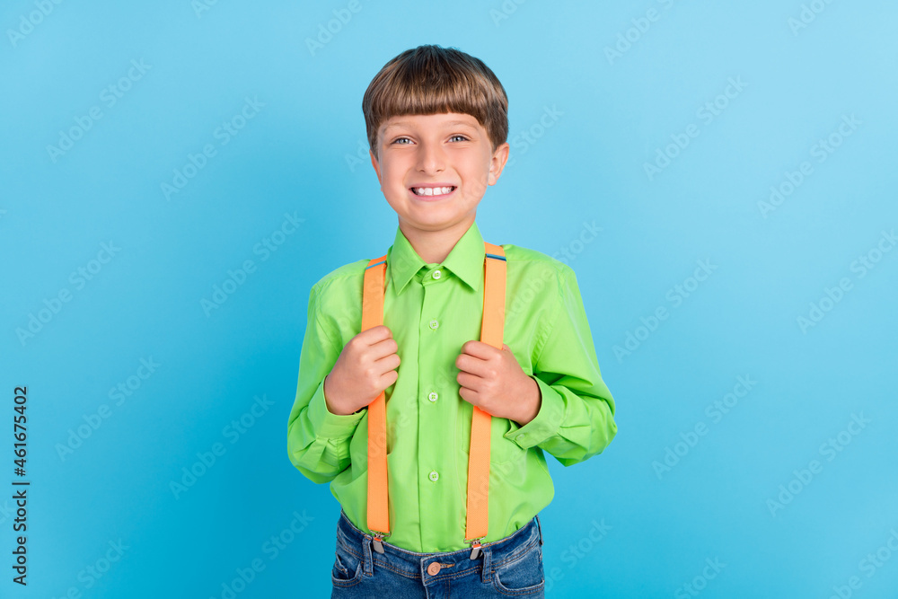 Photo portrait little boy smiling cheerful happy in shirt isolated pastel blue color background Photo portrait little boy smiling cheerful happy in shirt isolated pastel blue color background