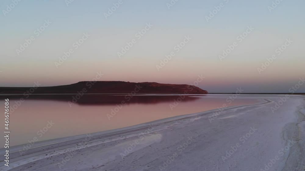 Aerial view Downward tilted in low key Pink Salt Lake. Cinematic film grain. Evening shot. Naturally Produced Healthy Pink Salt Aerial view Downward tilted in low key Pink Salt Lake. Cinematic film grain. Evening shot. Naturally Produced Healthy Pink Salt