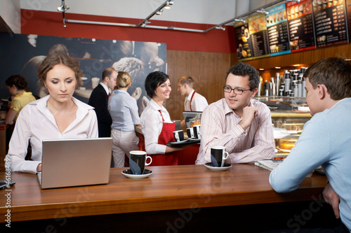 Business people in coffee shop © ER Creative Services