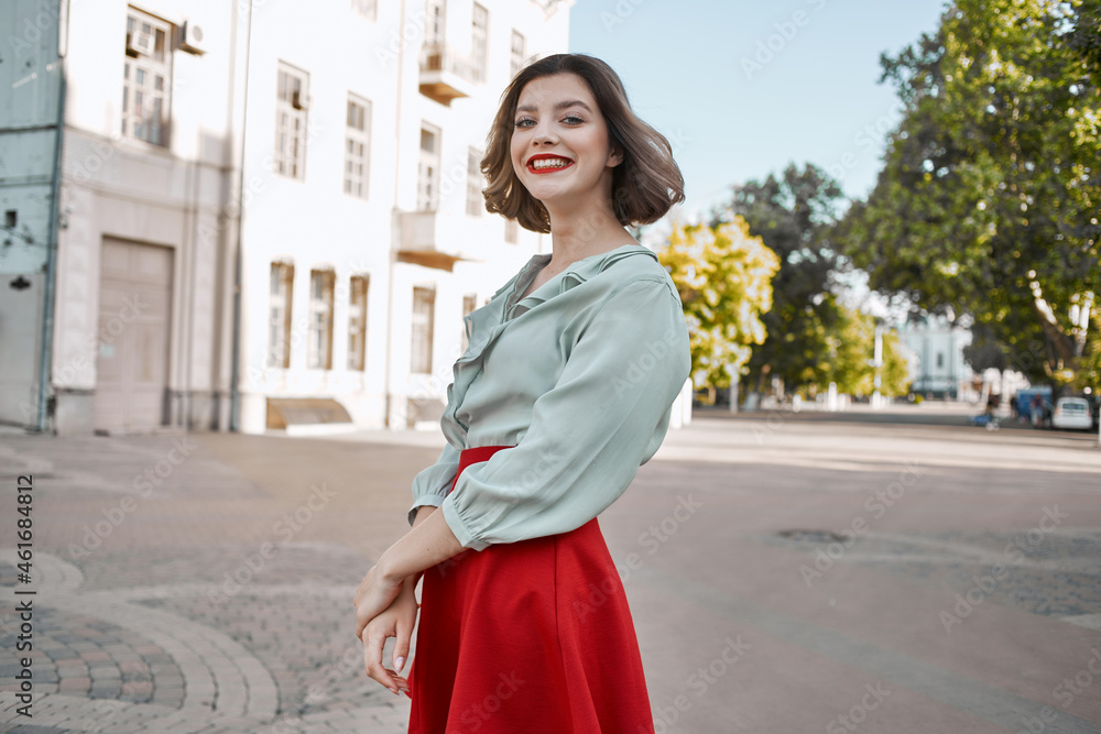 cheerful woman in a red skirt city walk fun leisure lifestyle cheerful woman in a red skirt city walk fun leisure lifestyle