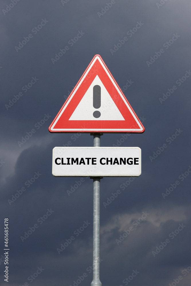 A sign with a exclamation mark warning for a dangerous situation ahead and a smaller sign below with the English text Climate Change on it A sign with a exclamation mark warning for a dangerous situation ahead and a smaller sign below with the English text Climate Change on it