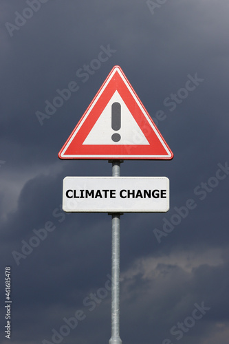 A sign with a exclamation mark warning for a dangerous situation ahead and a smaller sign below with the English text Climate Change on it