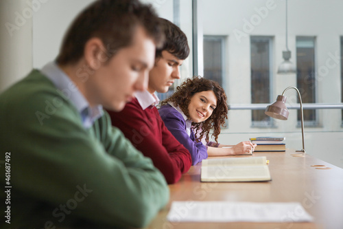 Students at desk in library