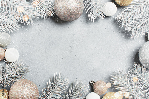 Christmas background with frosted Christmas tree branches and baubles