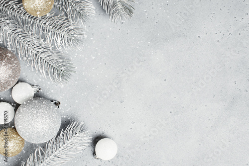 Christmas background with frosted Christmas tree branches and baubles
