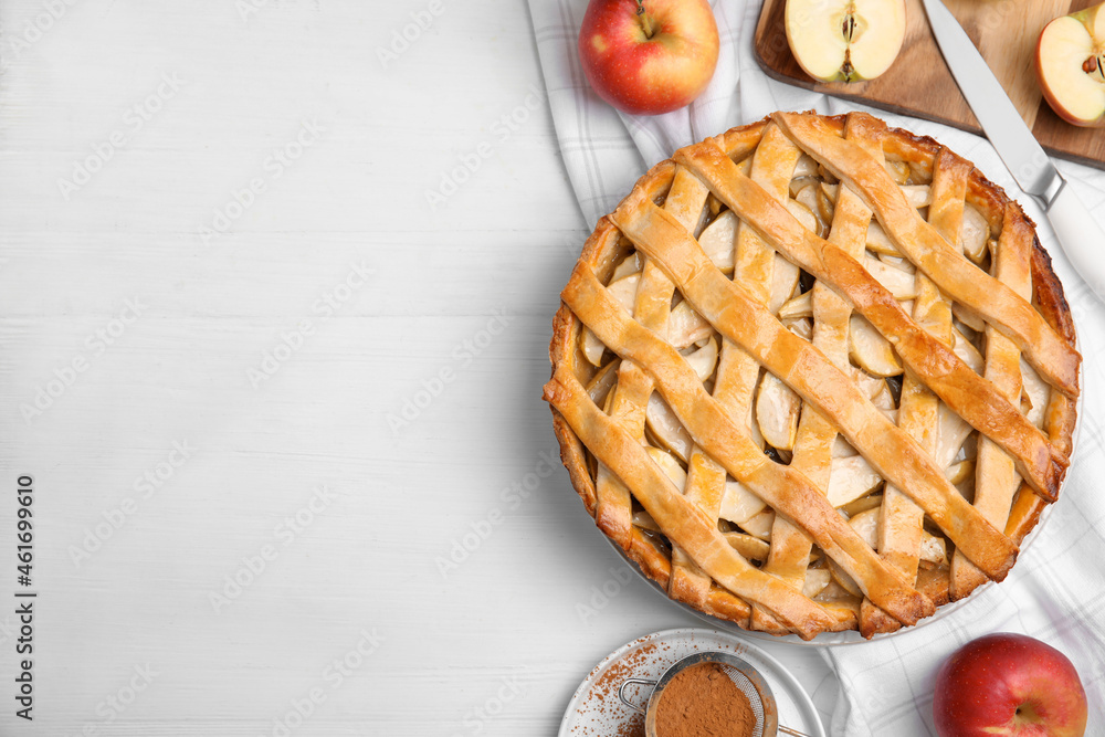 Delicious traditional apple pie on white table, flat lay. Space for text - obrazy, fototapety, plakaty 