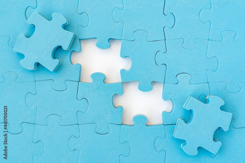 Two puzzle pieces revealing white background Two puzzle pieces revealing white background