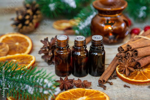 Christmas essential oils in small bottles. Selective focus.