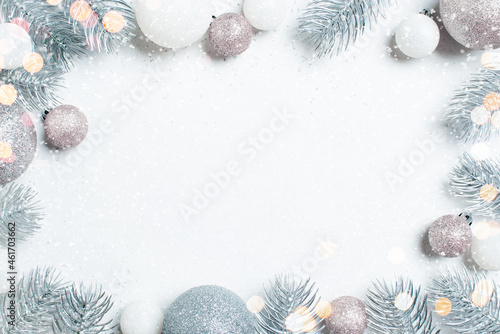 Christmas background with frosted Christmas tree branches and baubles