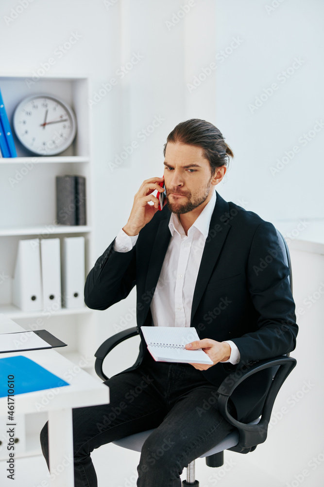 Man office work documents with a phone in hand technology Man office work documents with a phone in hand technology