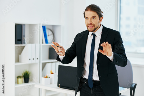 man in a suit holding a phone telephone office technologies