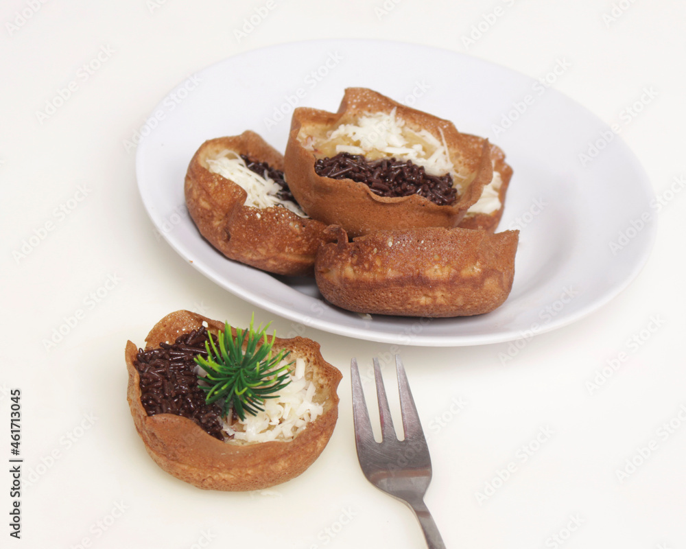 Mini moonlit cake with chocolate and cheese topping. This cake is very easy to find along the roadside. This cake is suitable to be eaten at night as a snack with the family. Focus blur. Mini moonlit cake with chocolate and cheese topping. This cake is very easy to find along the roadside. This cake is suitable to be eaten at night as a snack with the family. Focus blur.