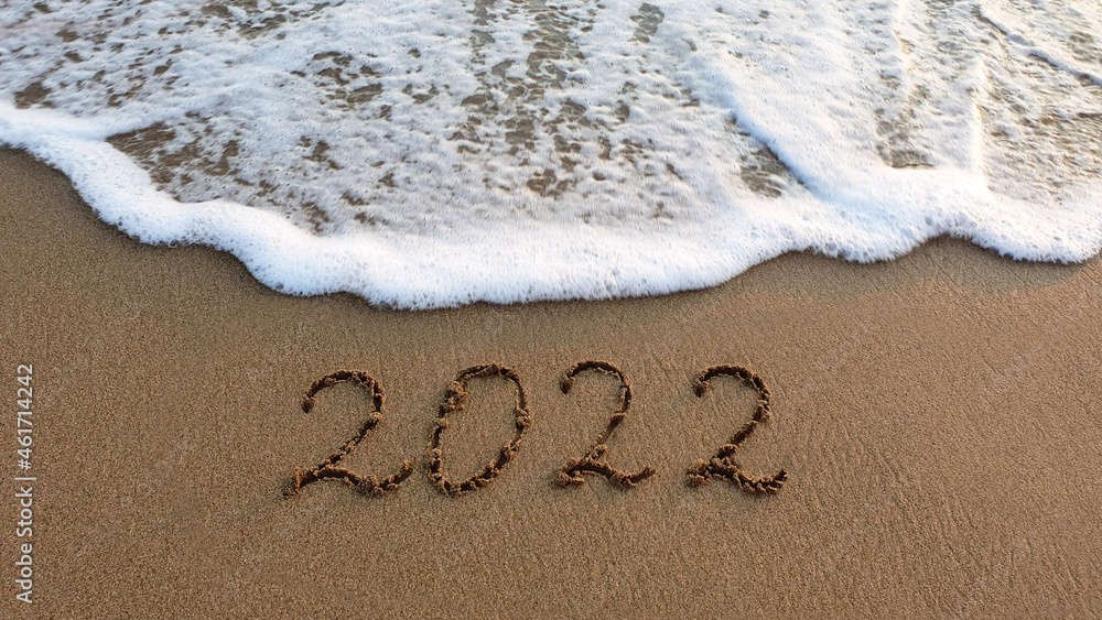 Fototapeta premium New Year 2022 is coming concept on tropical beach.
