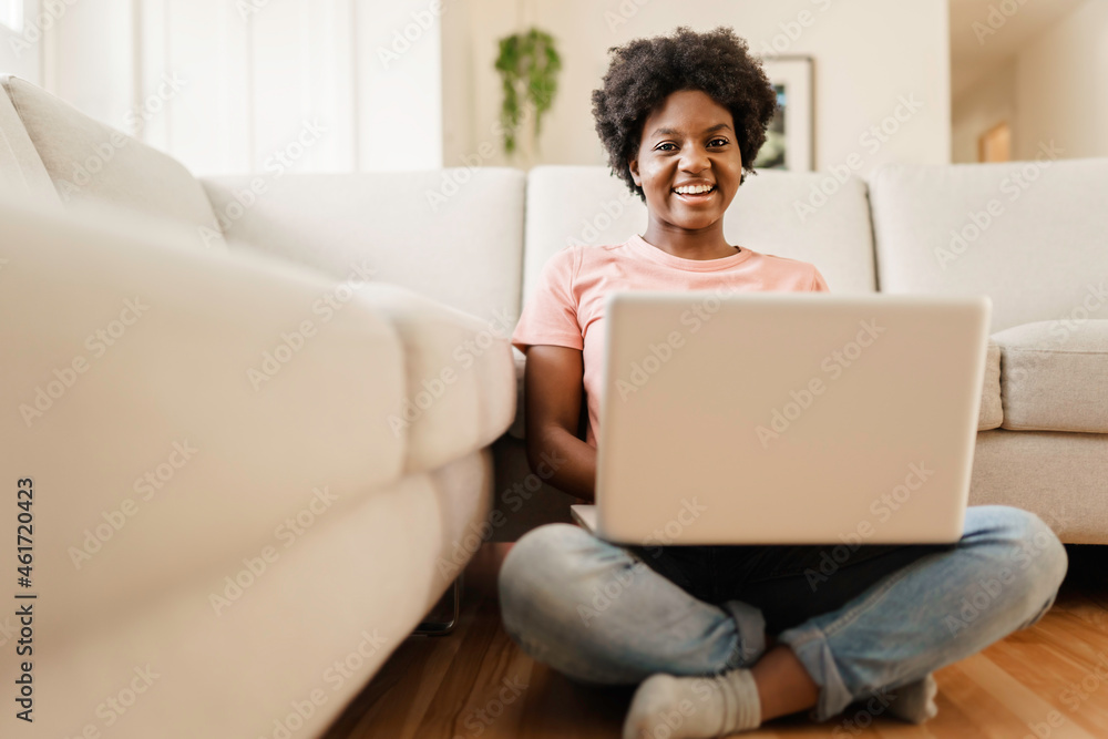 attractive young woman working with laptop on couch attractive young woman working with laptop on couch