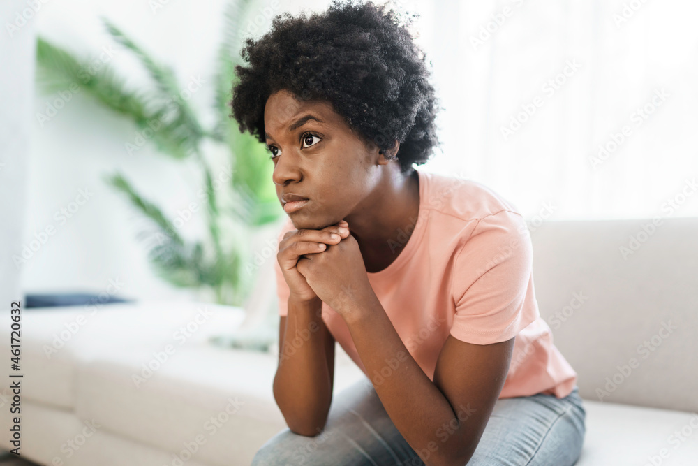Young woman in stress on the living room Young woman in stress on the living room
