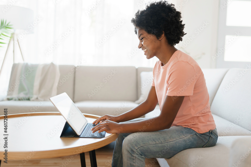 attractive young woman working with tablet on couch attractive young woman working with tablet on couch