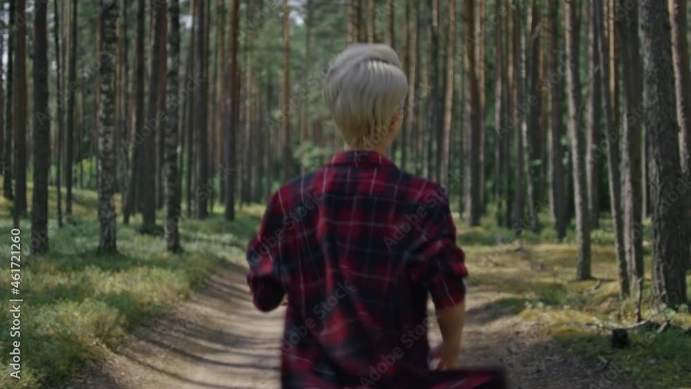 Cinematic portrait of beautiful young woman run in forest, smile and ...