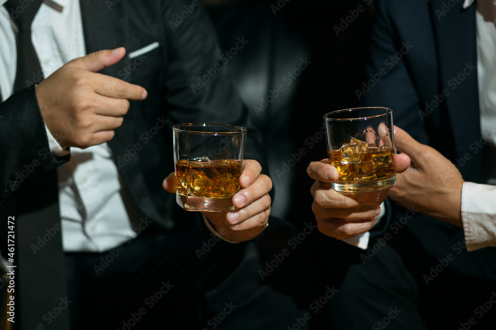 Businessmen in suits drinking  Celebrate whiskey
