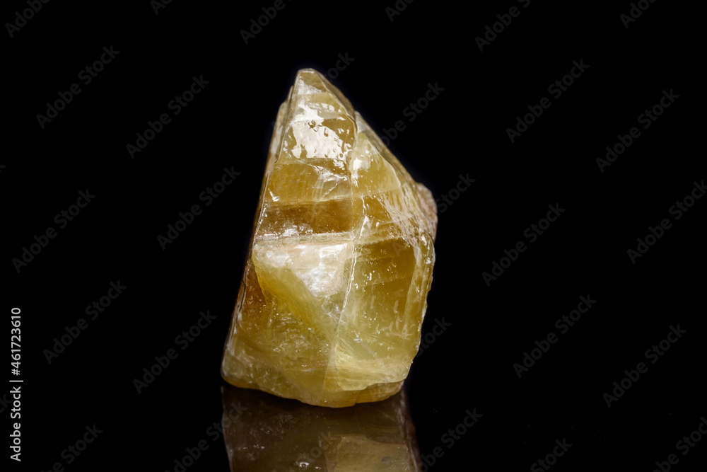 Macro mineral stone yellow Calcite on a black background Macro mineral stone yellow Calcite on a black background