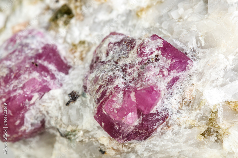 Macro mineral stone Ruby in rock on white background Macro mineral stone Ruby in rock on white background