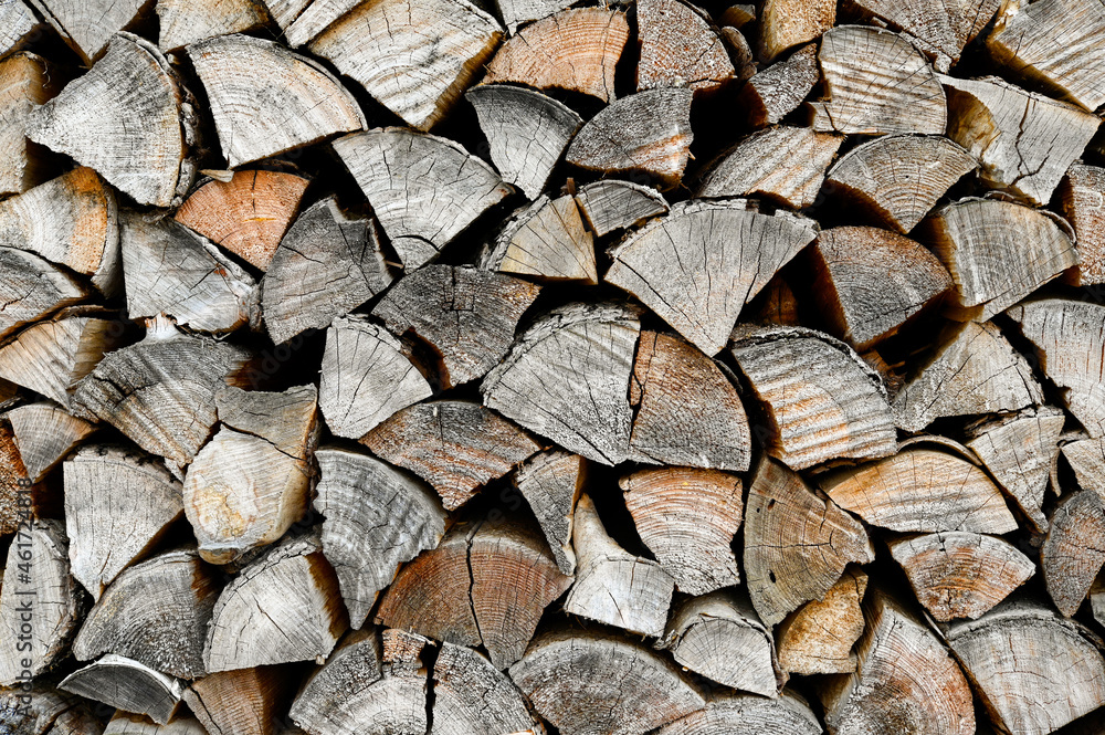 The background is made of old firewood. Preparation for winter. The background is made of old firewood. Preparation for winter.