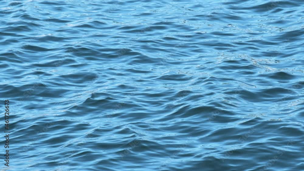 Slow motion of beautiful sea water surface with sparks Slow motion of beautiful sea water surface with sparks