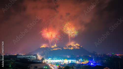 Firework and smoke sparkling in dark sky over the hills at Phetchaburi, Phra Nakhon Khiri, Khao Wang, Thailand. Khao Wang fireworks Festival.