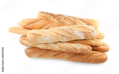 Different tasty baguettes on white background, top view. Fresh bread