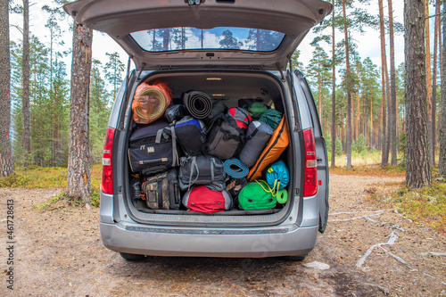 Travel backpacks with equipment in the trunk of the minibus.