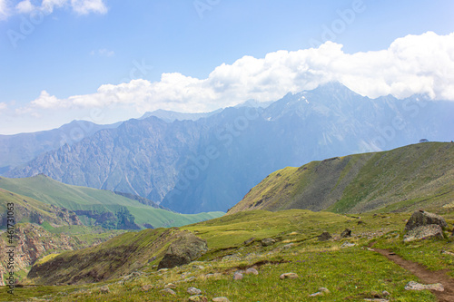 Mountain landscape. View of the mountains, mountain valleys and clouds above them.